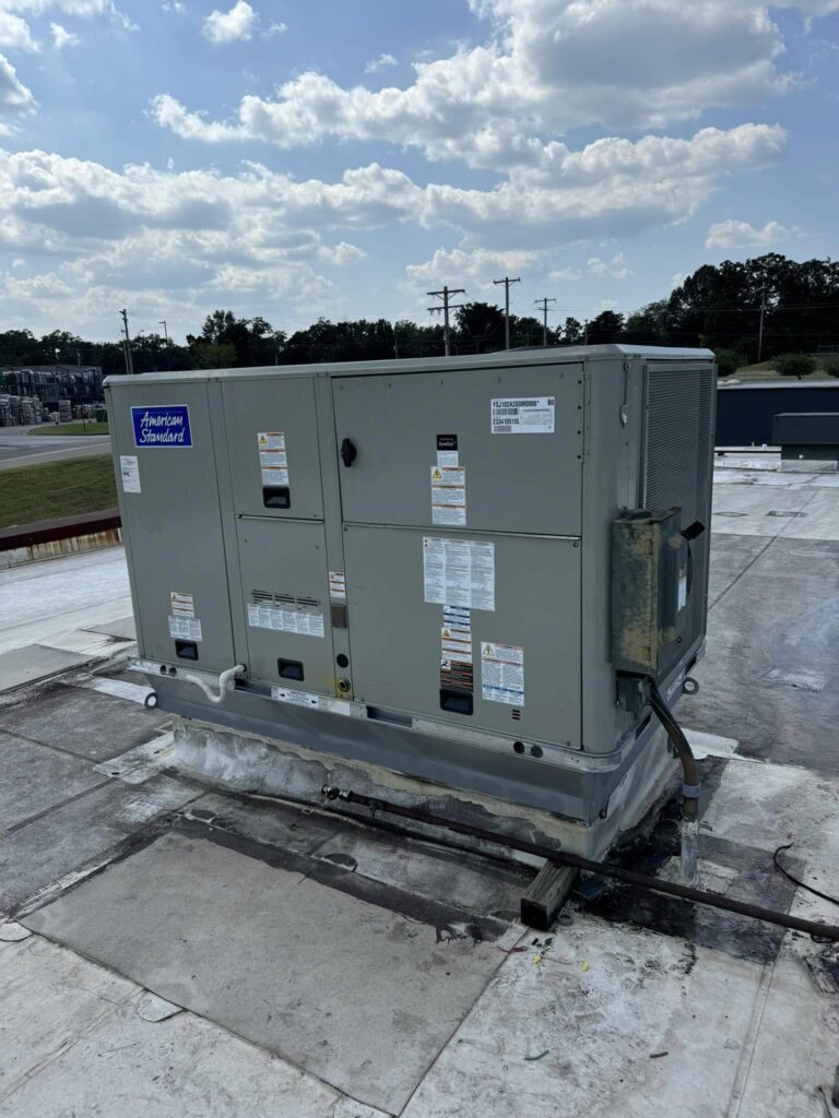 American Standard rooftop HVAC unit installed on a flat commercial roof