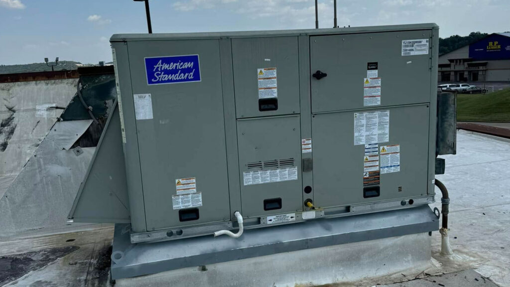 American Standard rooftop HVAC unit installed on a commercial building's flat roof